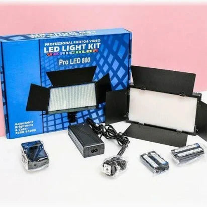 LED light kit with accessories and packaging on a pink background